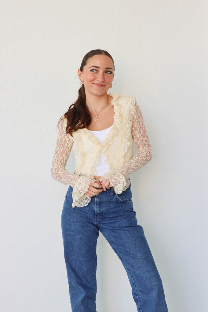 girl wearing cream lace top