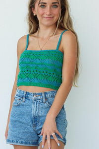 girl wearing blue and green crochet knit tank top