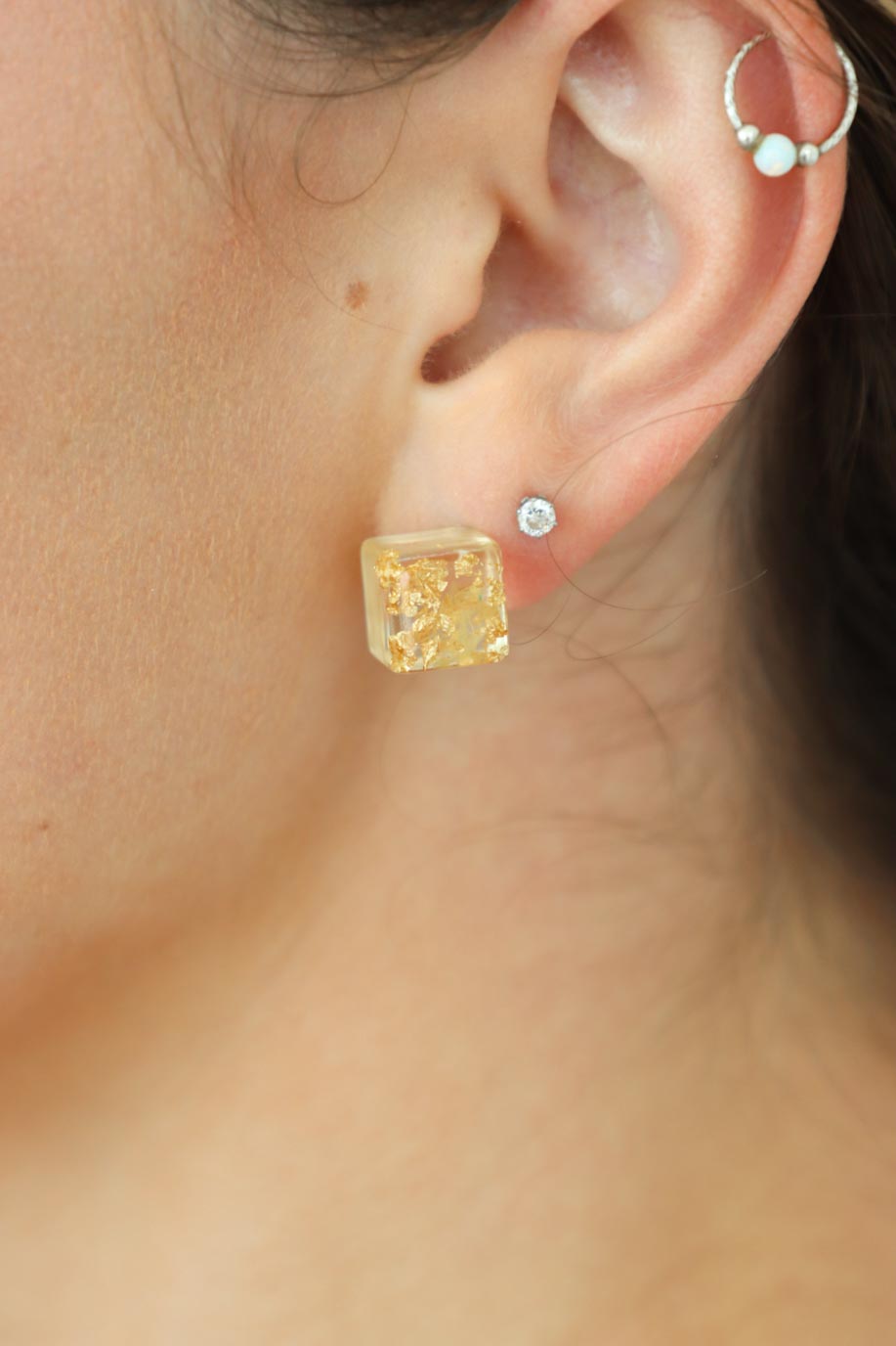 girl wearing yellow square resin earrings