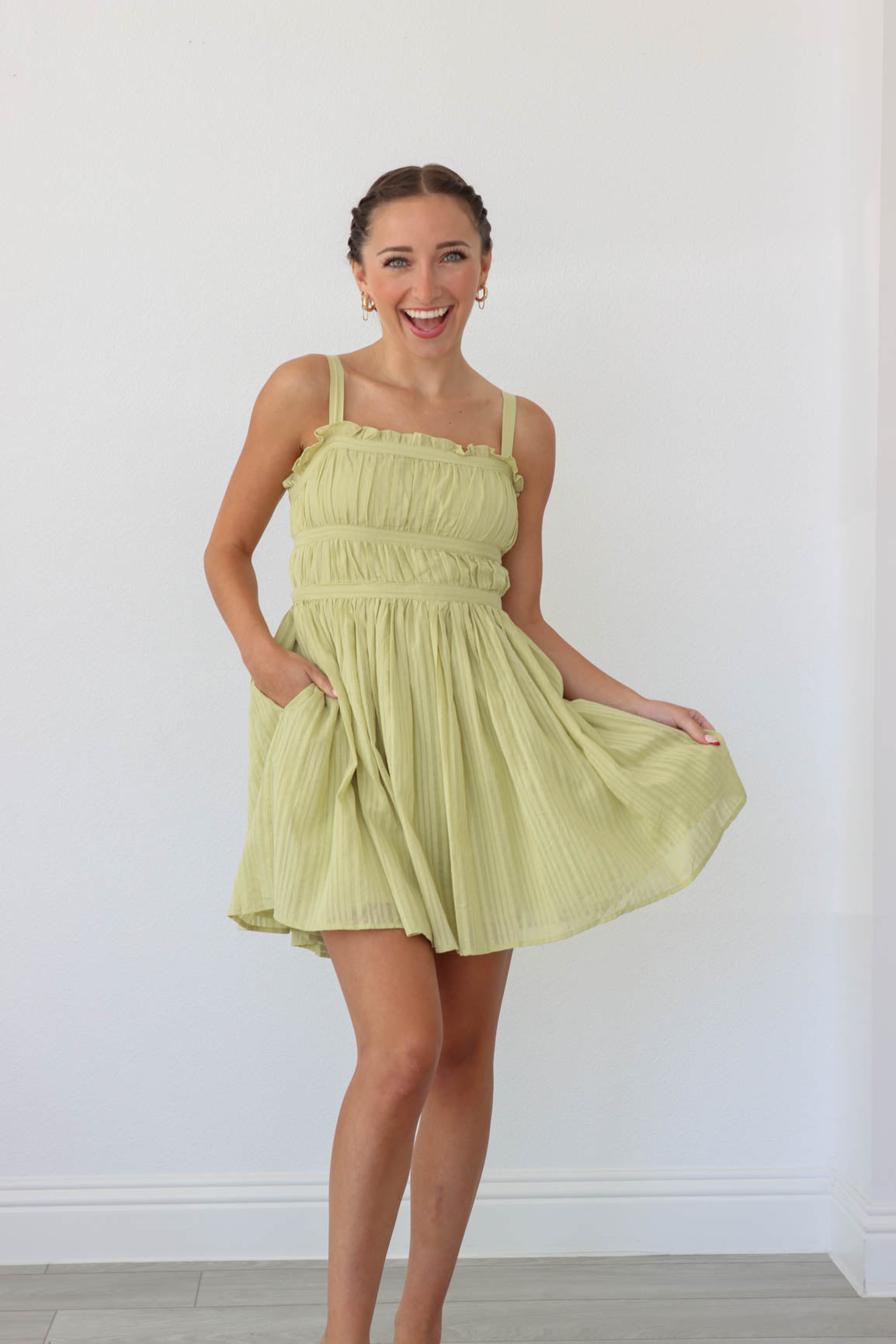 girl wearing light green short dress