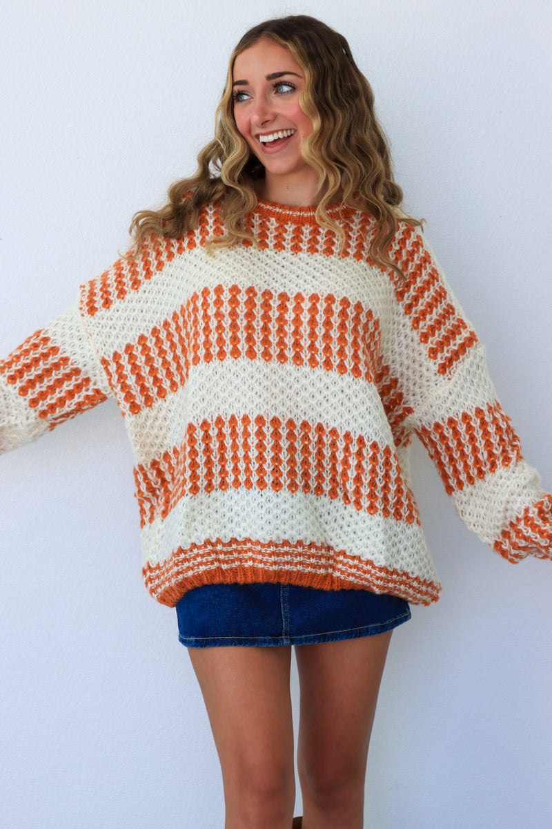 cream & orange striped sweater