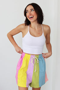 girl wearing multicolored drawstring shorts