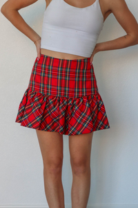 girl wearing red plaid skirt