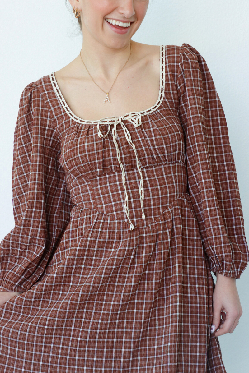 girl wearing brown peasant style dress