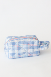 Blue and white checkered pouch on a white background