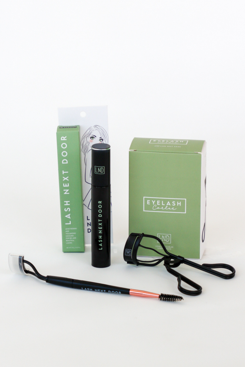 Eyelash extension kit with tools and packaging on a white background