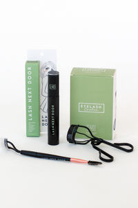 Eyelash extension tools and packaging on a white background