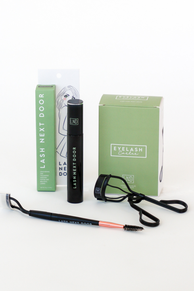 Eyelash extension tools and packaging on a white background