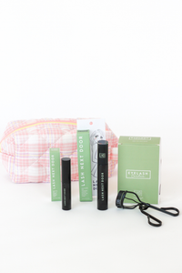 Eyelash extensions with packaging and a pouch on a white background