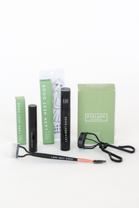 Eyelash extension kit with tools and packaging on a white background