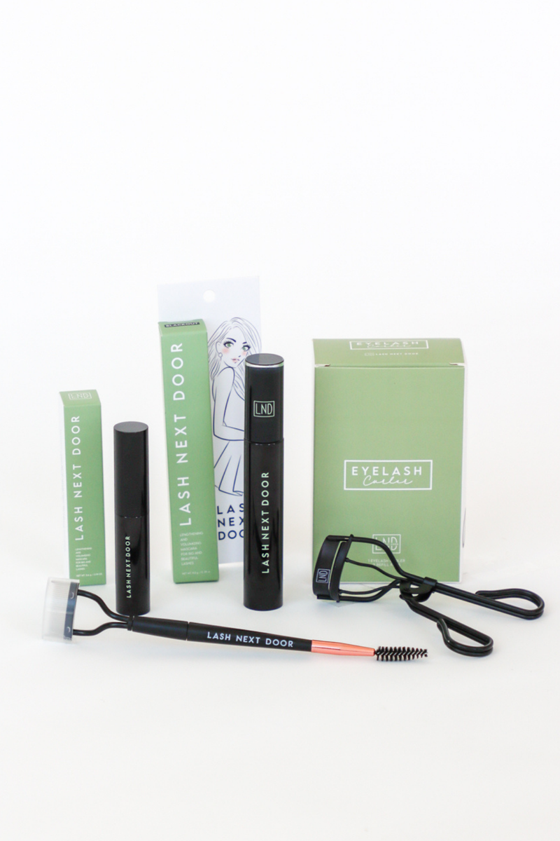 Eyelash extension kit with tools and packaging on a white background