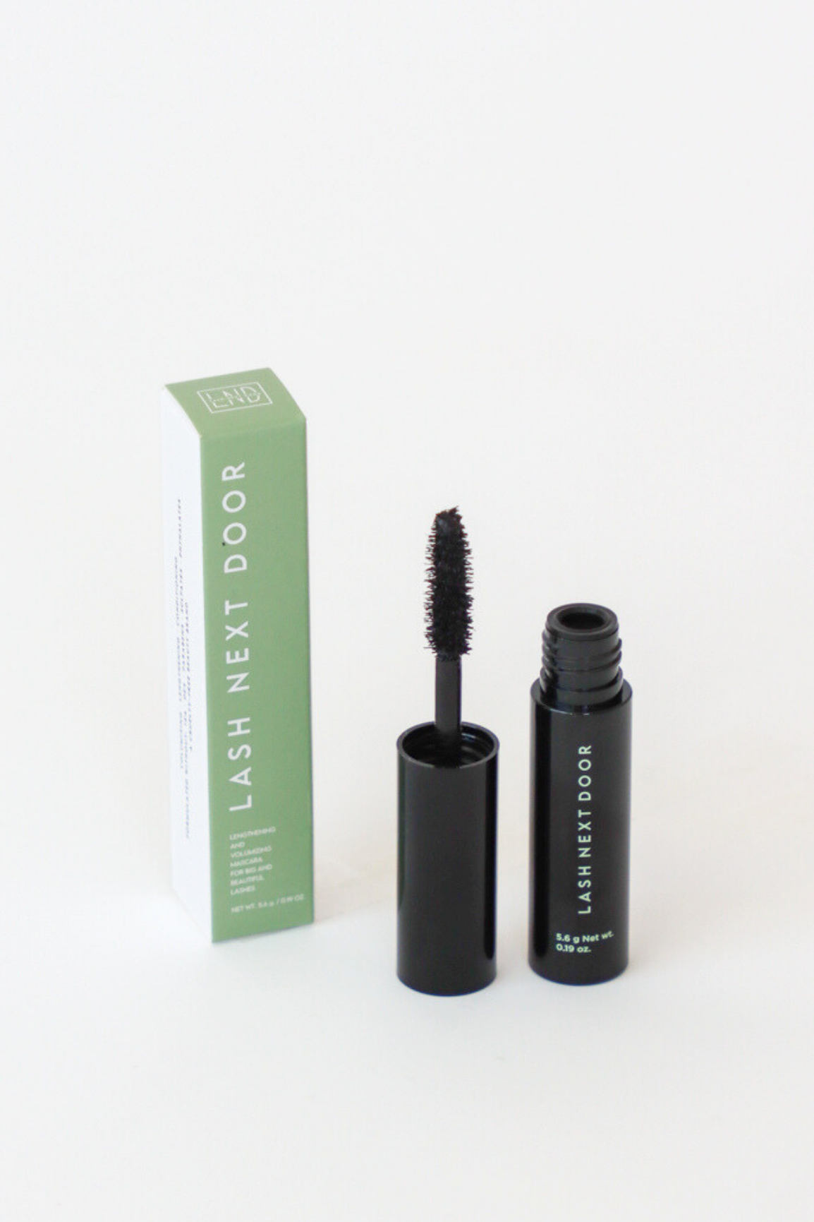 Mascara with open and closed cases on a white background