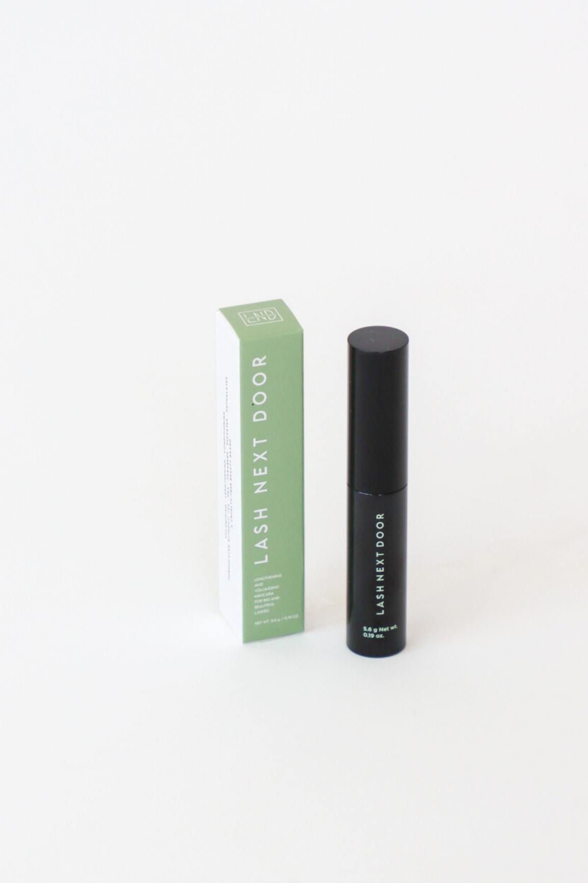 Black eyelash product with green box on a white background