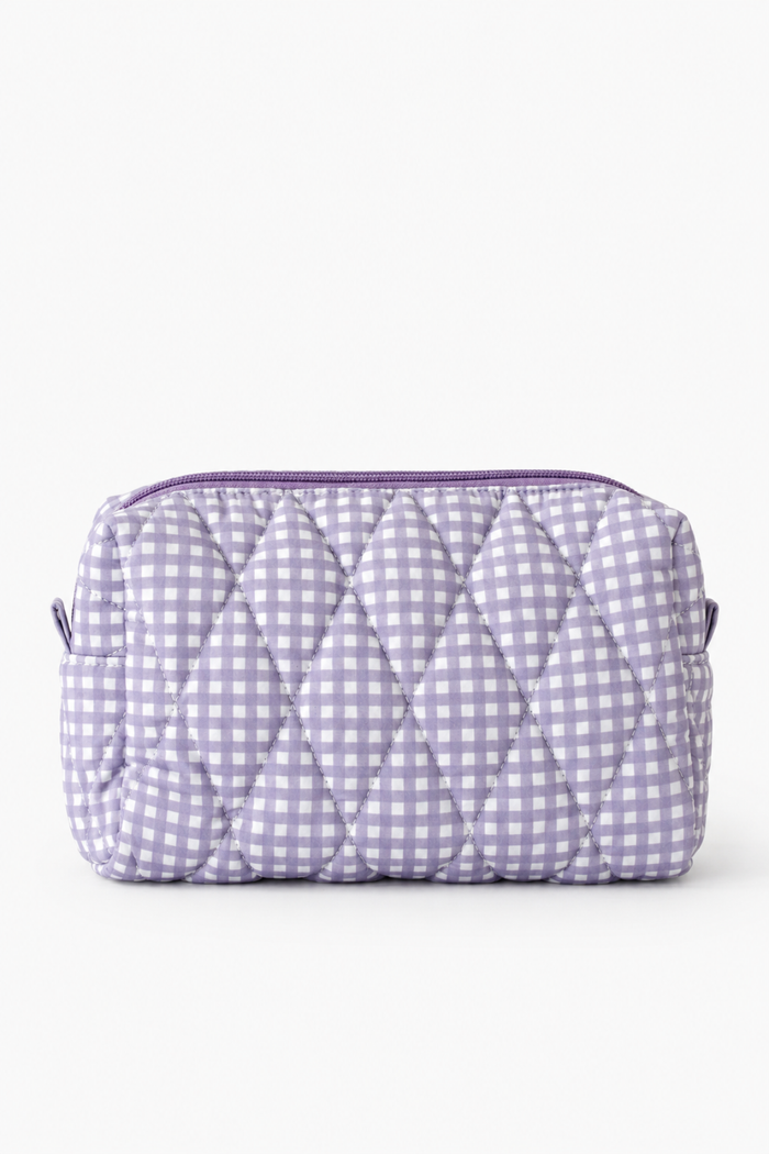 A light purple and white gingham quilted cosmetic pouch with a top zipper closure, shown against a plain white background.