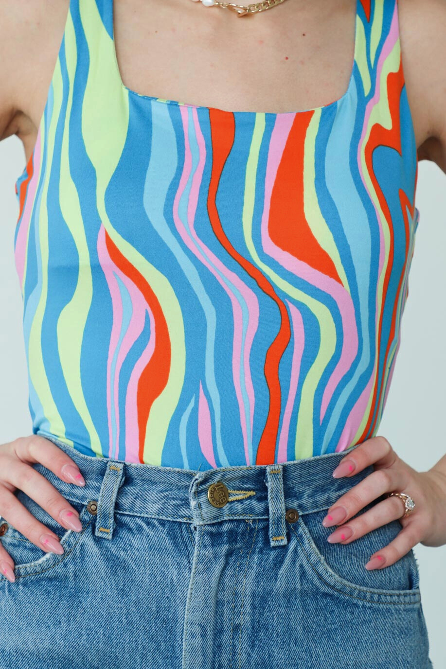 girl wearing multicolored patterned bodysuit