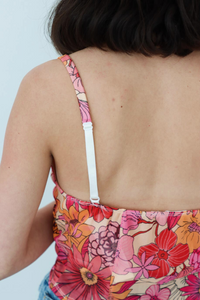 adjustable straps on a red floral tank top