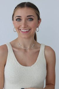 girl wearing beaded white choker