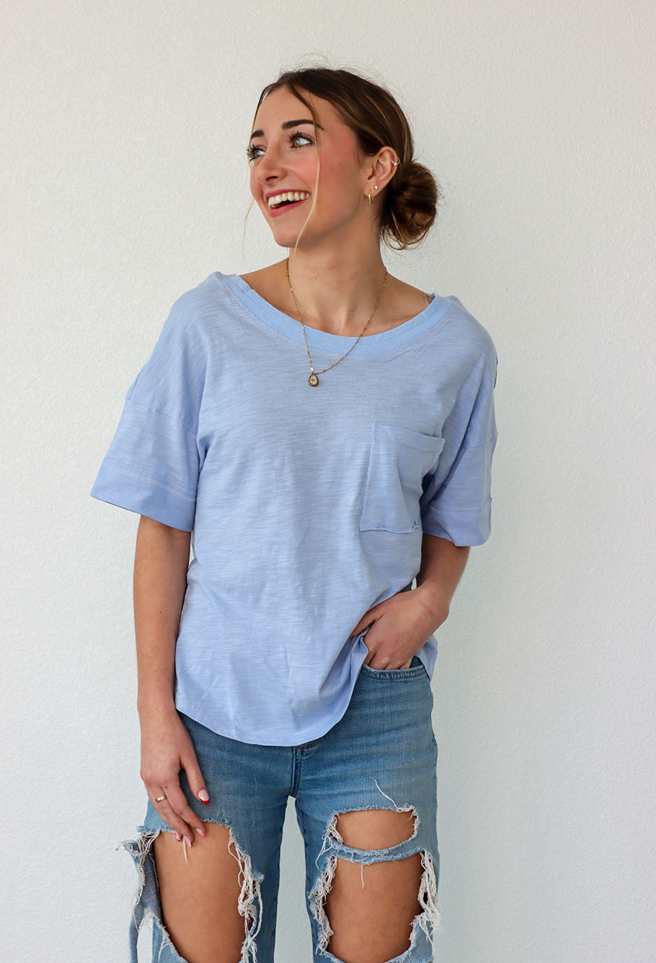 girl wearing a blue boxy t-shirt