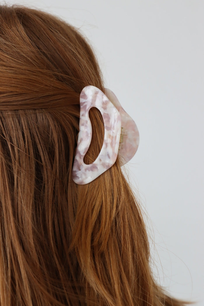 girl wearing pink acrylic clip in her hair