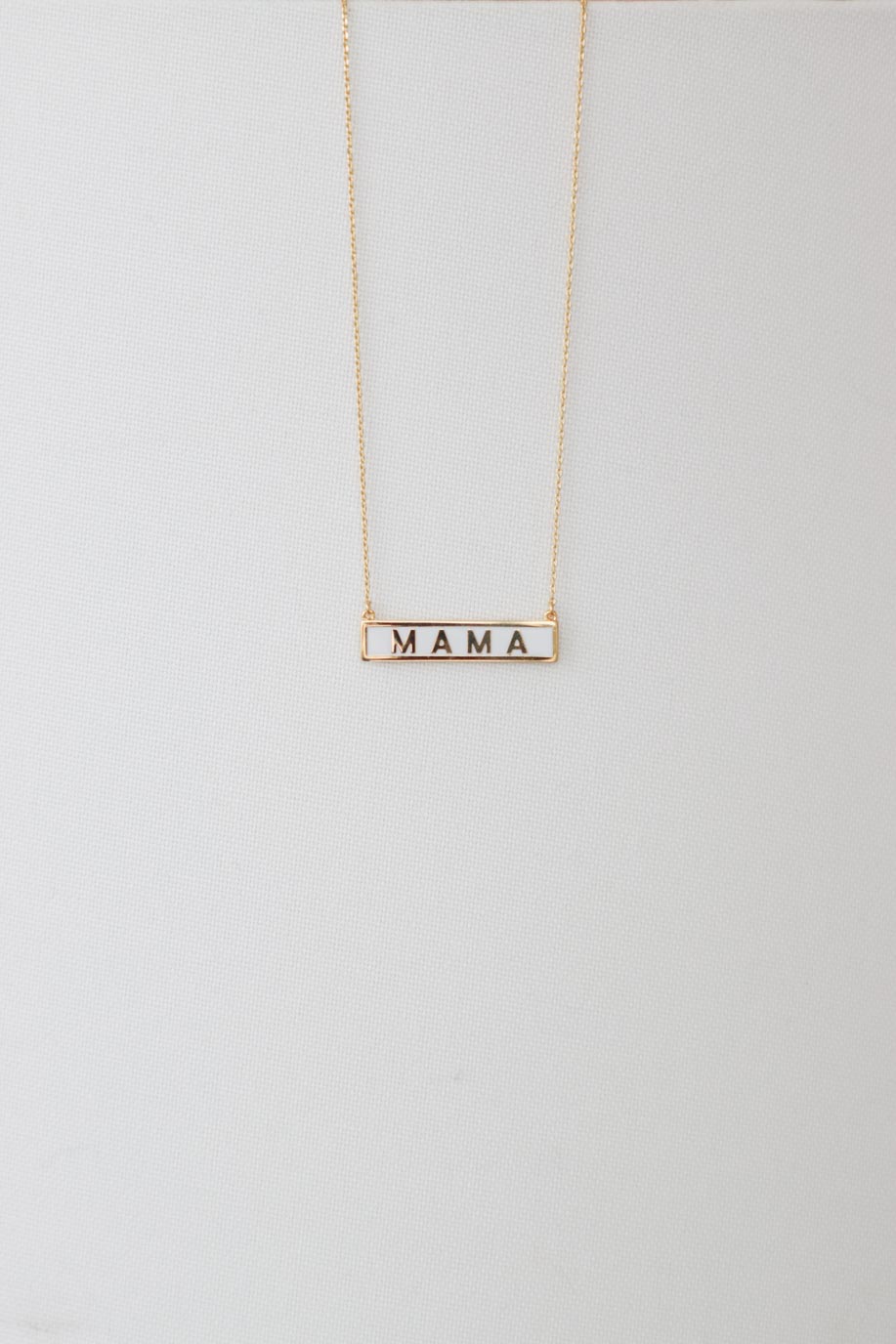 white and gold "mama" necklace