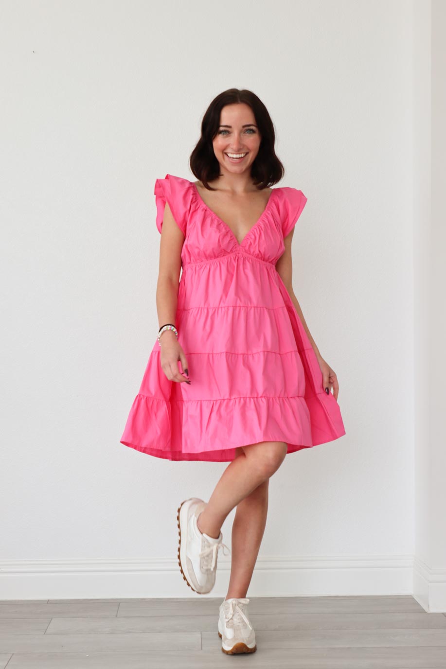 girl wearing pink ruched dress