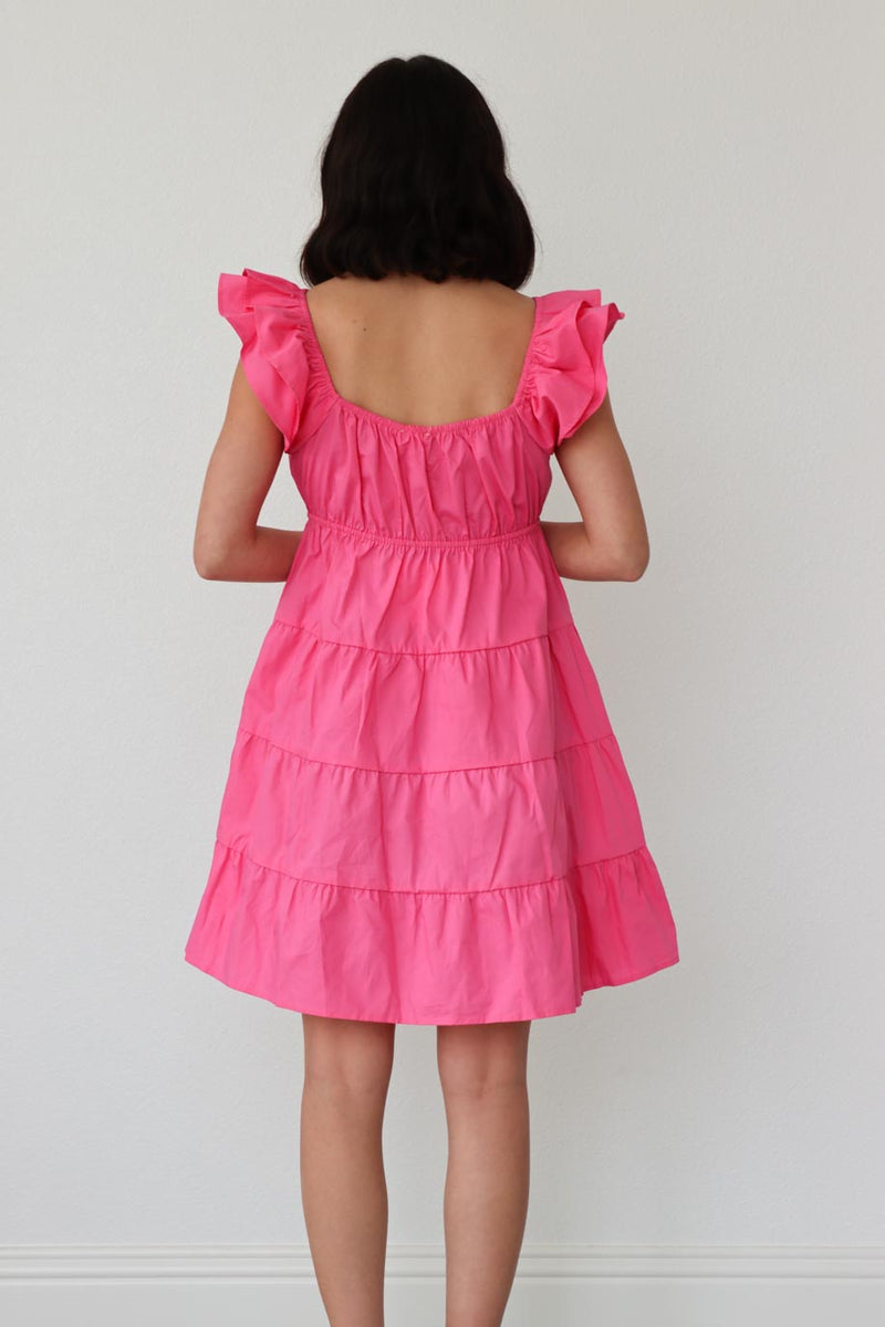 girl wearing pink ruched dress