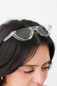 girl wearing clear acrylic sunglasses