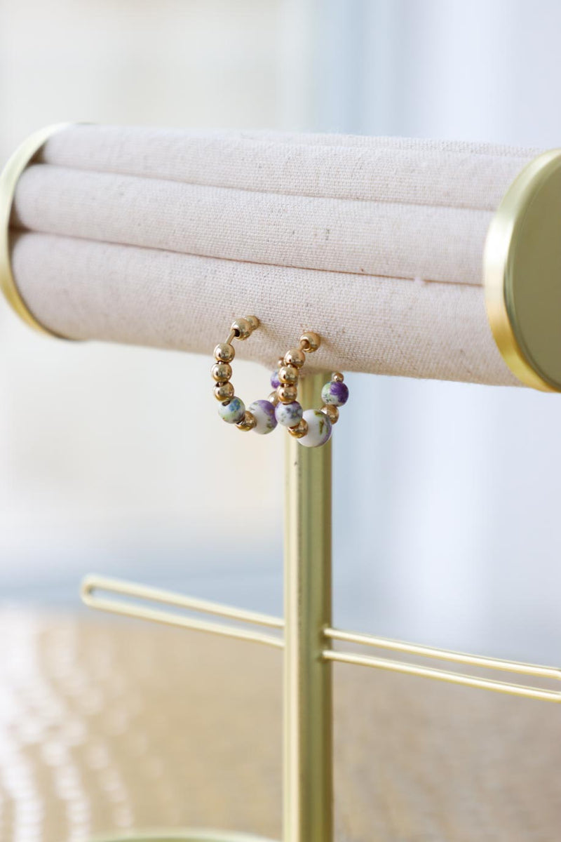 gold hoop earrings with floral glass beads