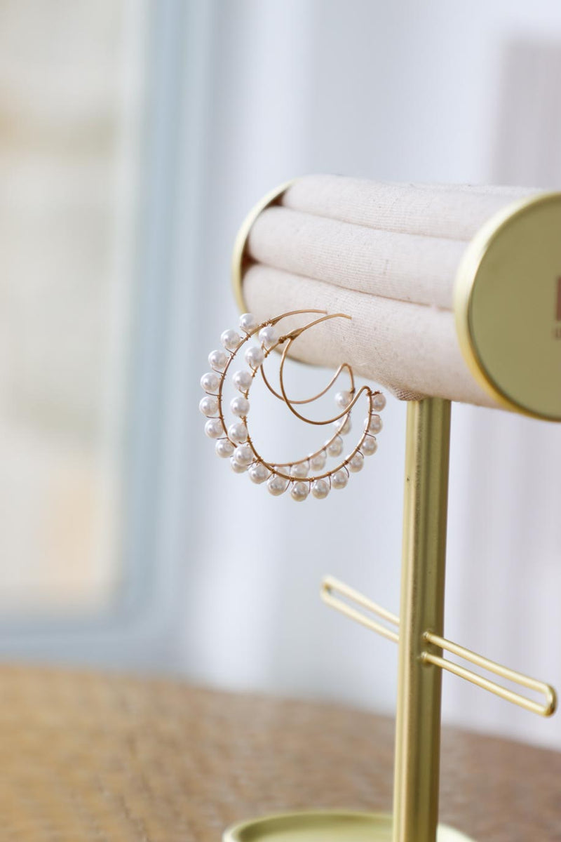 gold moon earrings with pearl detailing