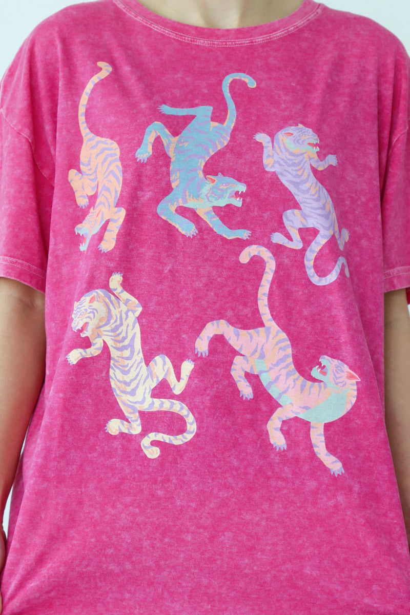 girl wearing pink tiger graphic t-shirt