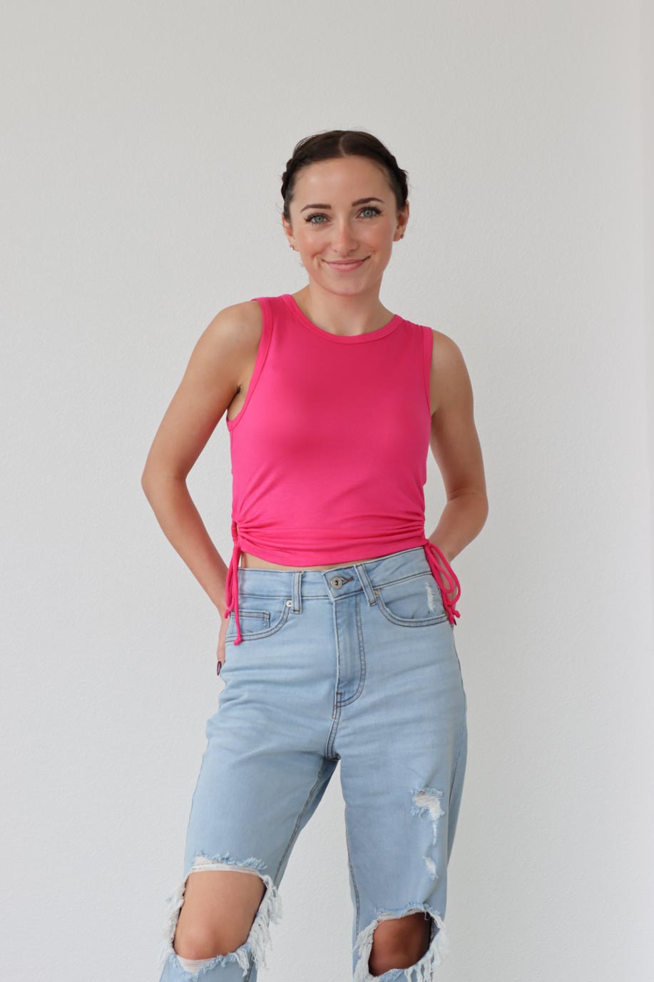 girl wearing hot pink tank top with ruched side detailing