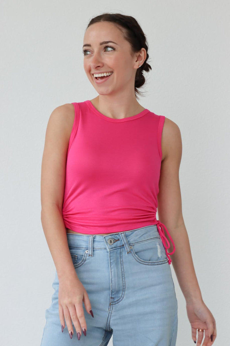 girl wearing hot pink tank top with ruched side detailing
