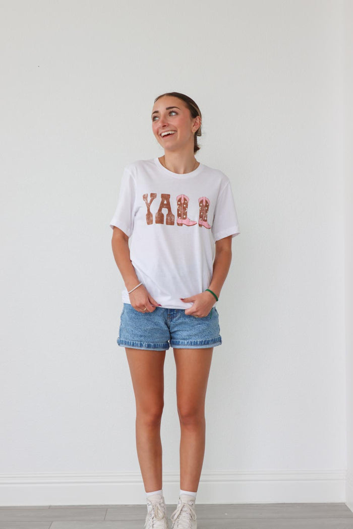 girl wearing white "y'all" graphic t-shirt