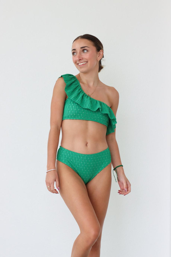 girl wearing one shoulder green ruffled bikini