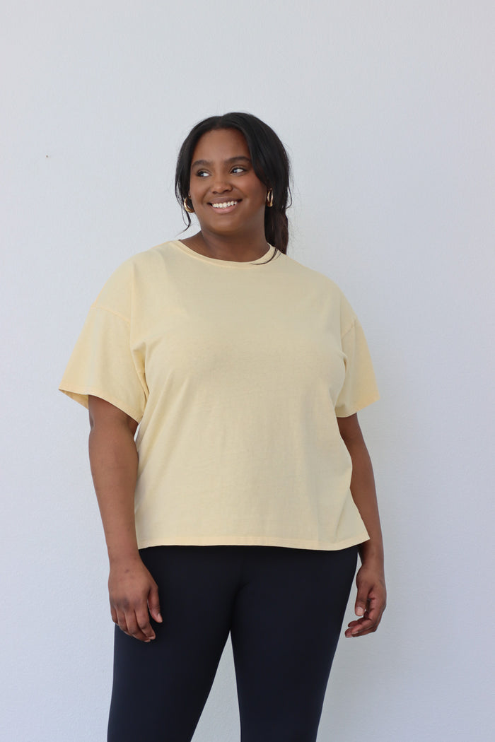 girl wearing yellow oversized t-shirt