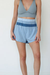 girl wearing blue athletic shorts