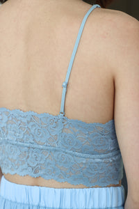 close up of adjustable straps of light blue bralette