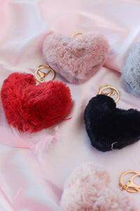multiple colors of a fluffy heart keychain
