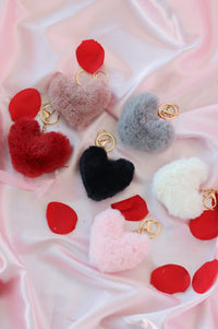 multiple colors of a fluffy heart keychain