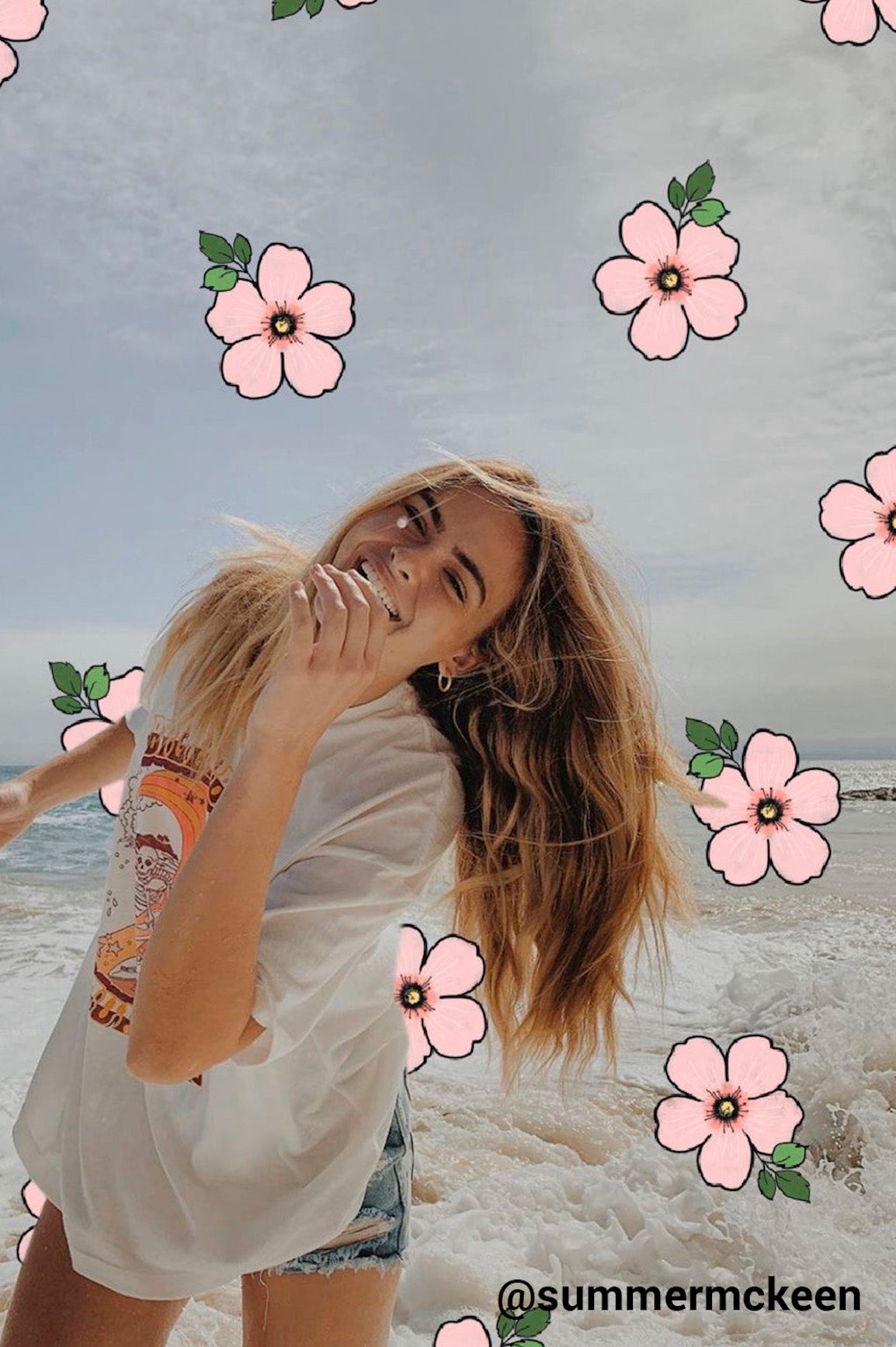 girl on beach with pink hawaiian flowers drawn on the photo