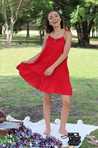 girl wearing red tiered dress