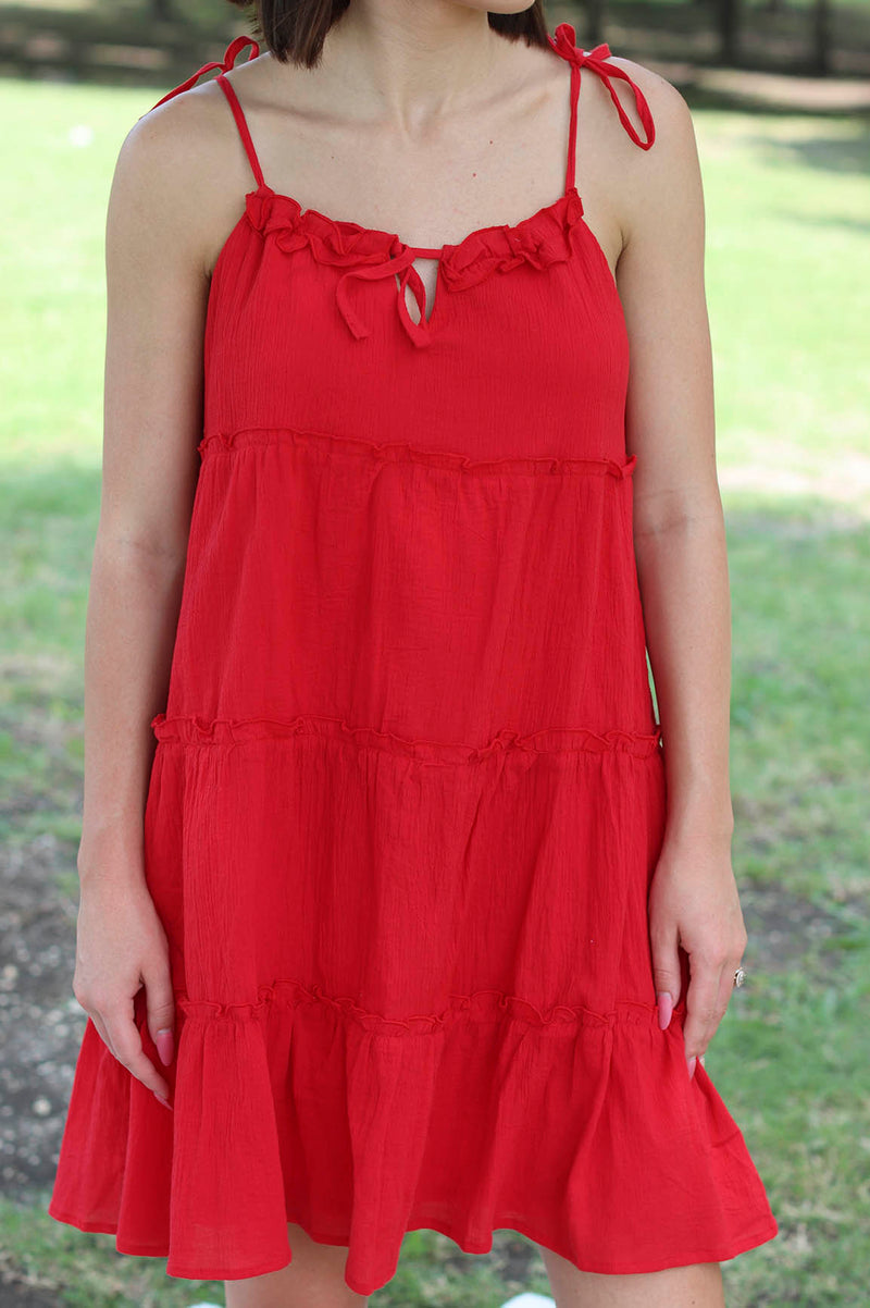 girl wearing red tiered dress