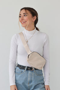 girl wearing ivory belt bag