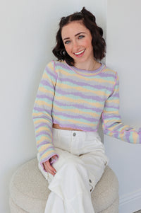 girl wearing a purple striped crop top