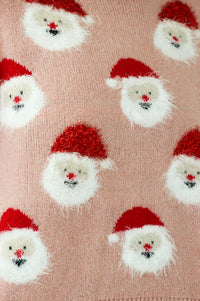 close up of fuzzy santas all over the sweater