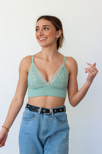 Girl wearing a lacey triangle bralette