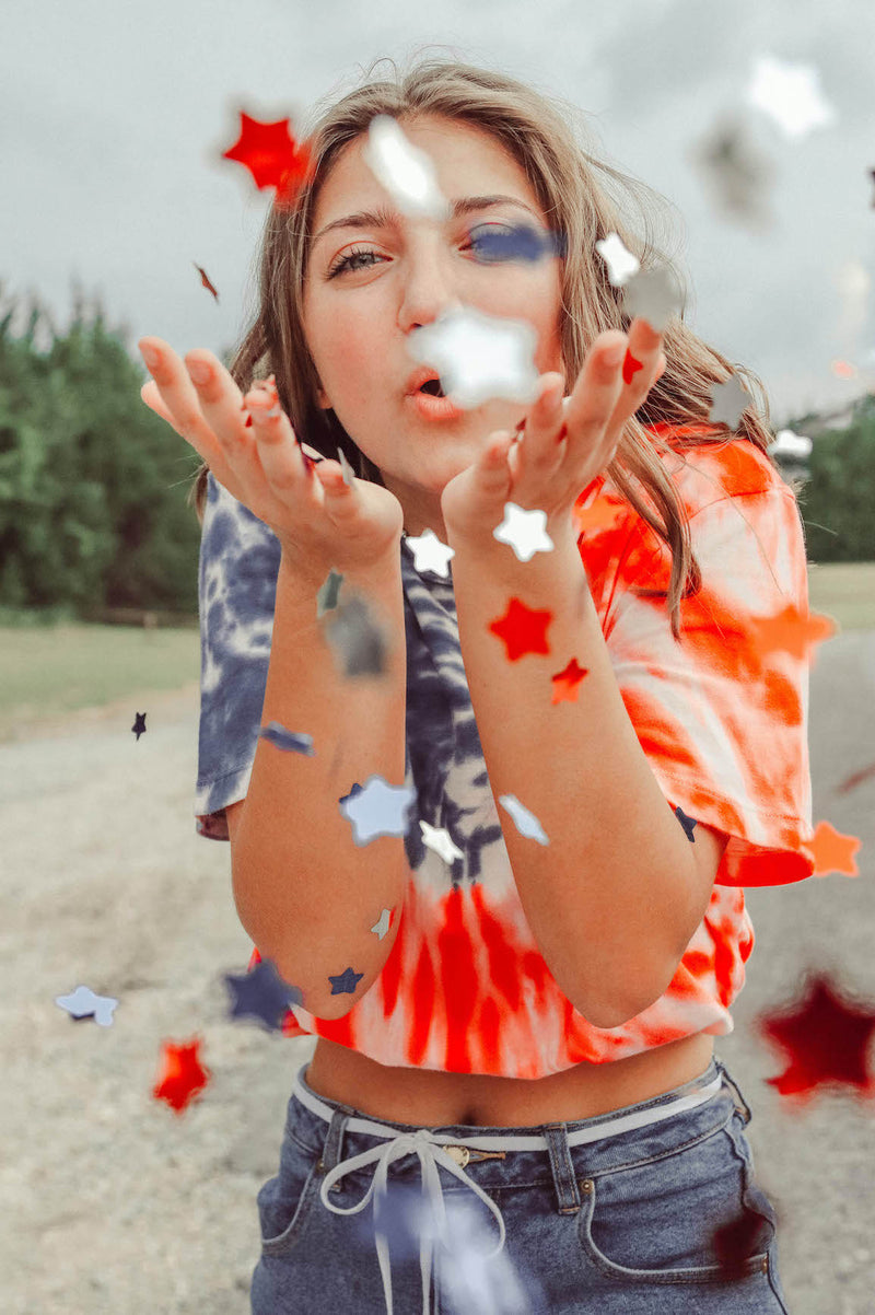 bloom preset after photo of a girl blowing confetti