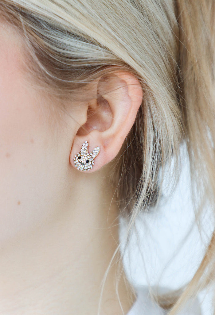 girl wearing gold easter bunny stud earrings