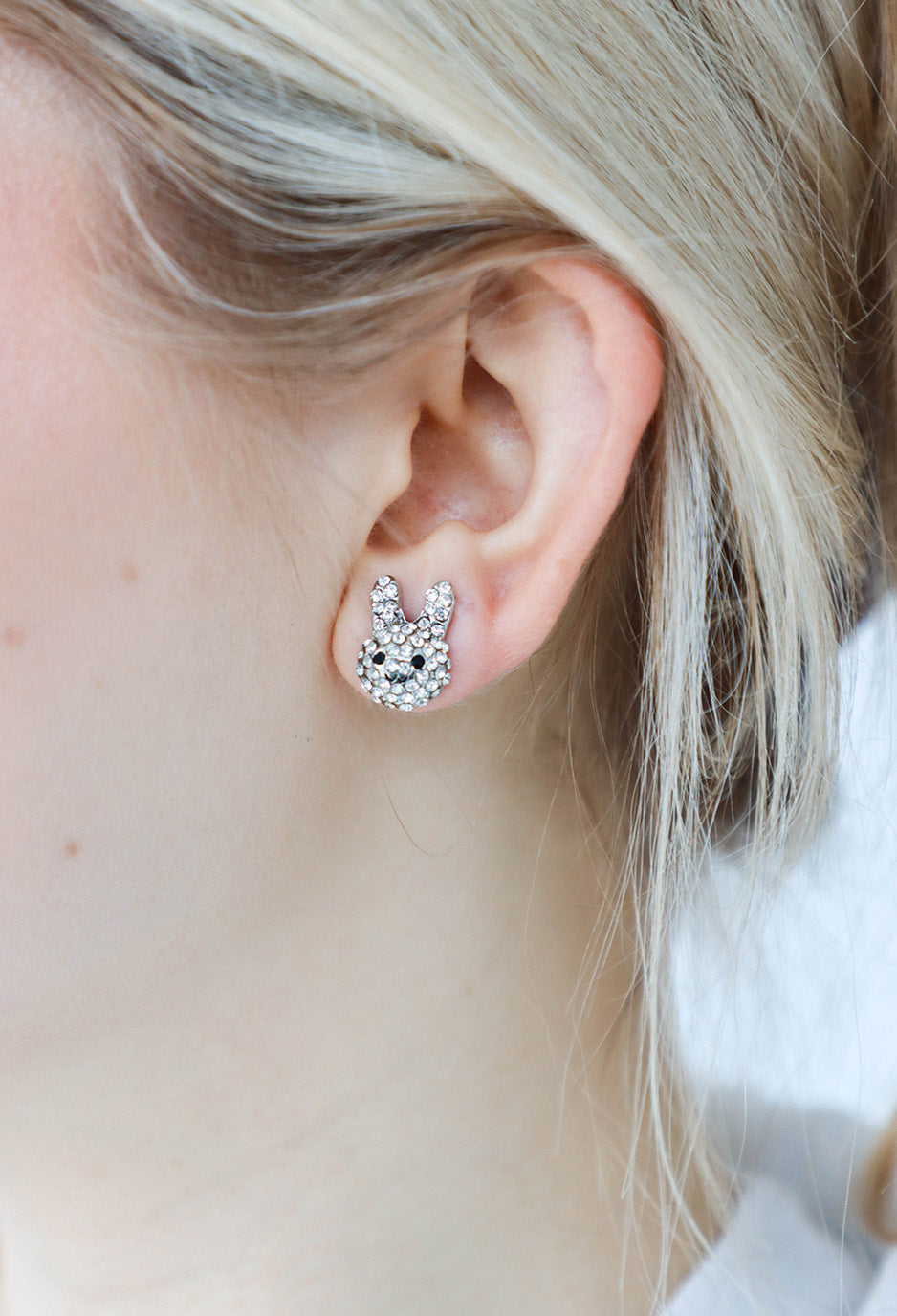 girl wearing silver easter bunny stud earrings