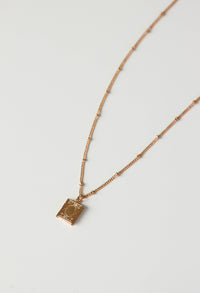 gold book necklace